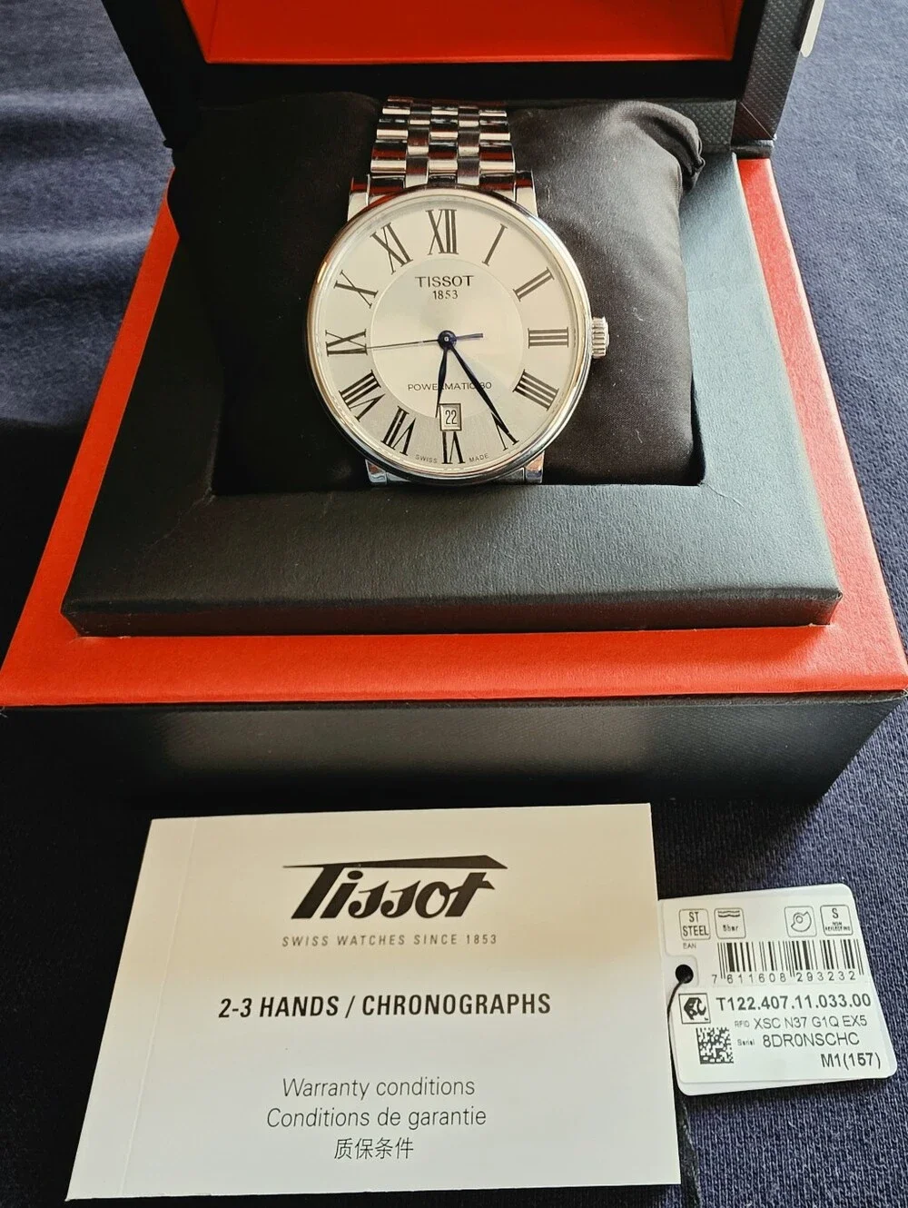 Tissot Silver Watch with Blue Hands and White Dial